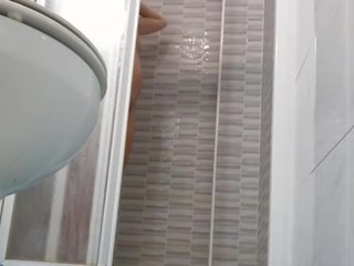 Spying on attractive Wife Shaving Pussy in Shower